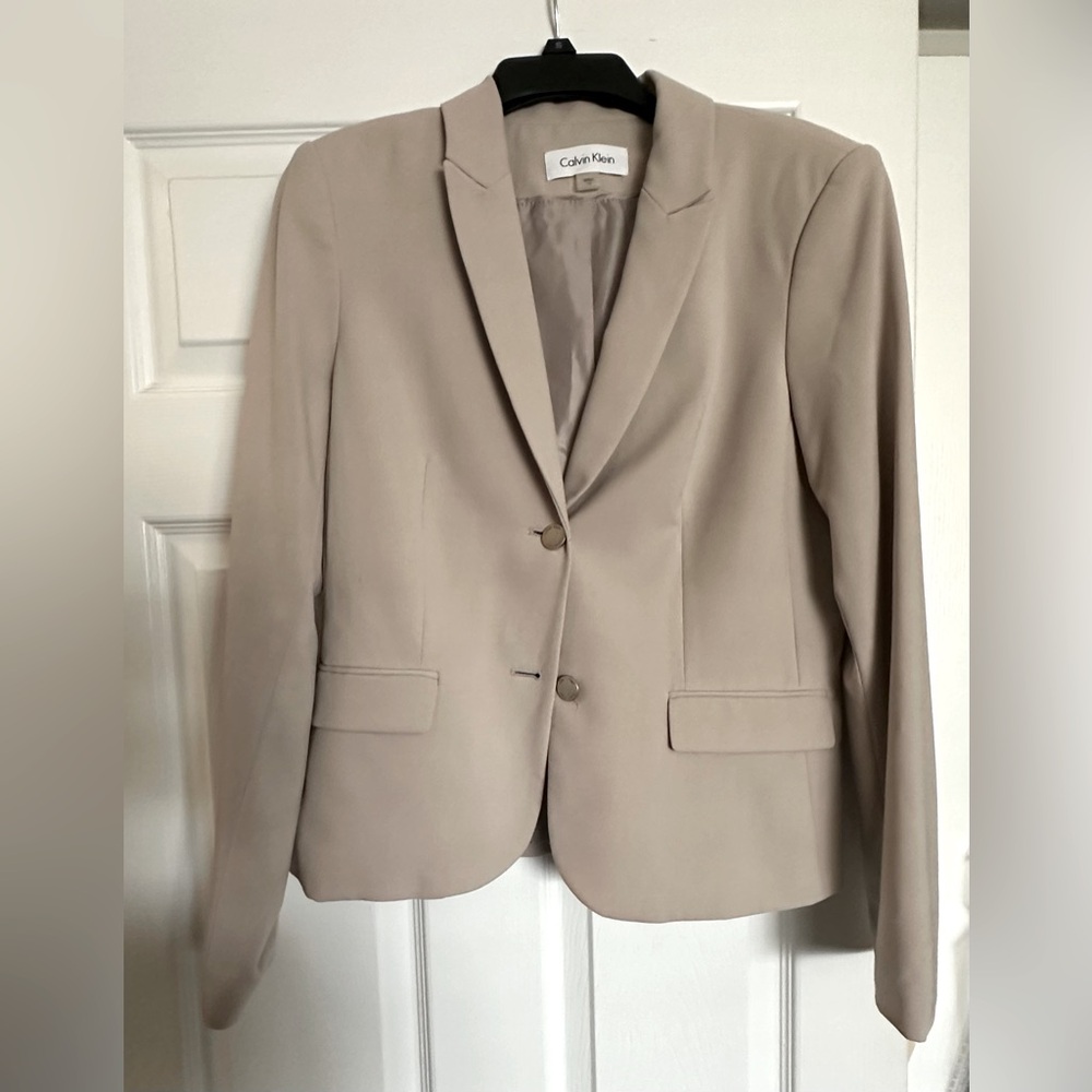 Calvin Klein tan women’s blazer, size 10, with shoulder pads. Hardly worn